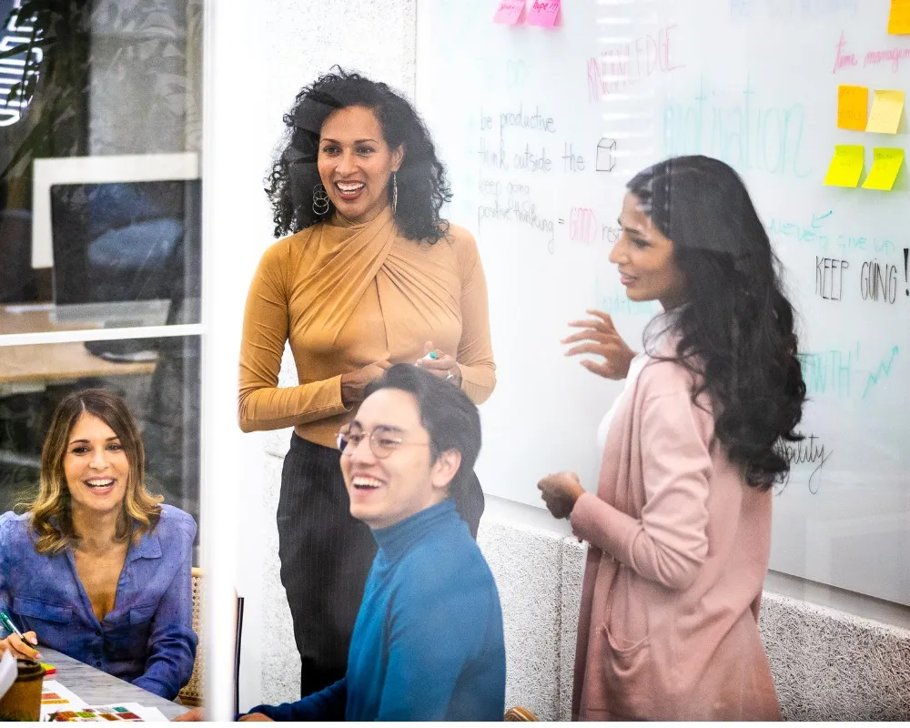Agile Project Manager talks to her team