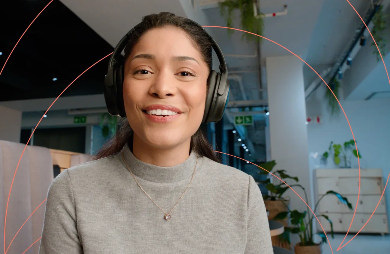 Smiling professional looking at the camera and wearing a headset
