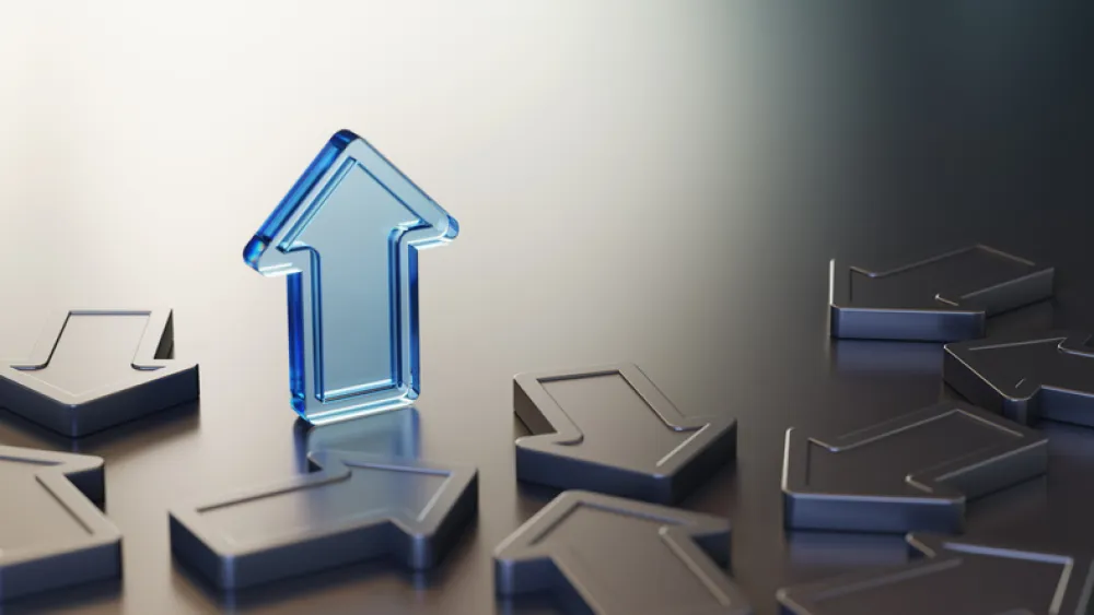 blue glass arrow pointing upwards